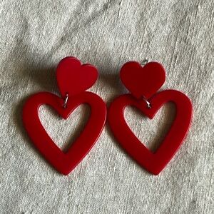 Cute fun vibrant true red heart dangle earrings.